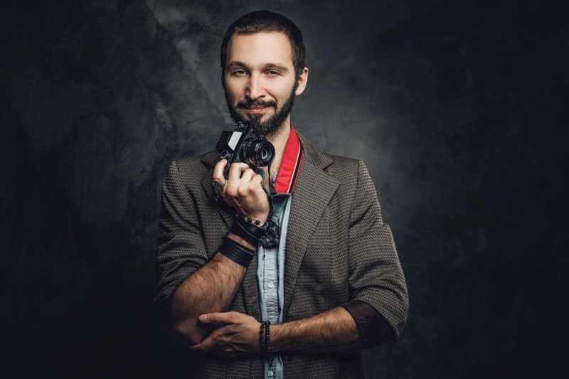 man-is-posing-for-photographer-with-photo-camera-2025-01-26-05-05-18-utcResized_7_11zon